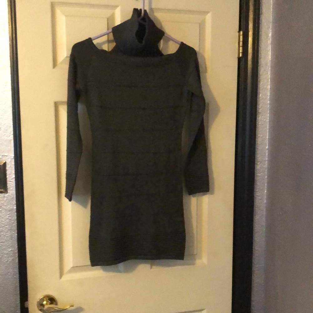 soft gray mini dress with scoop outs on the top. It’s a form fitting type dress.